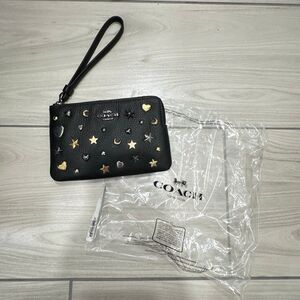 Brand new Coach Corner Zip Wristlet with Rivets star studs black leather